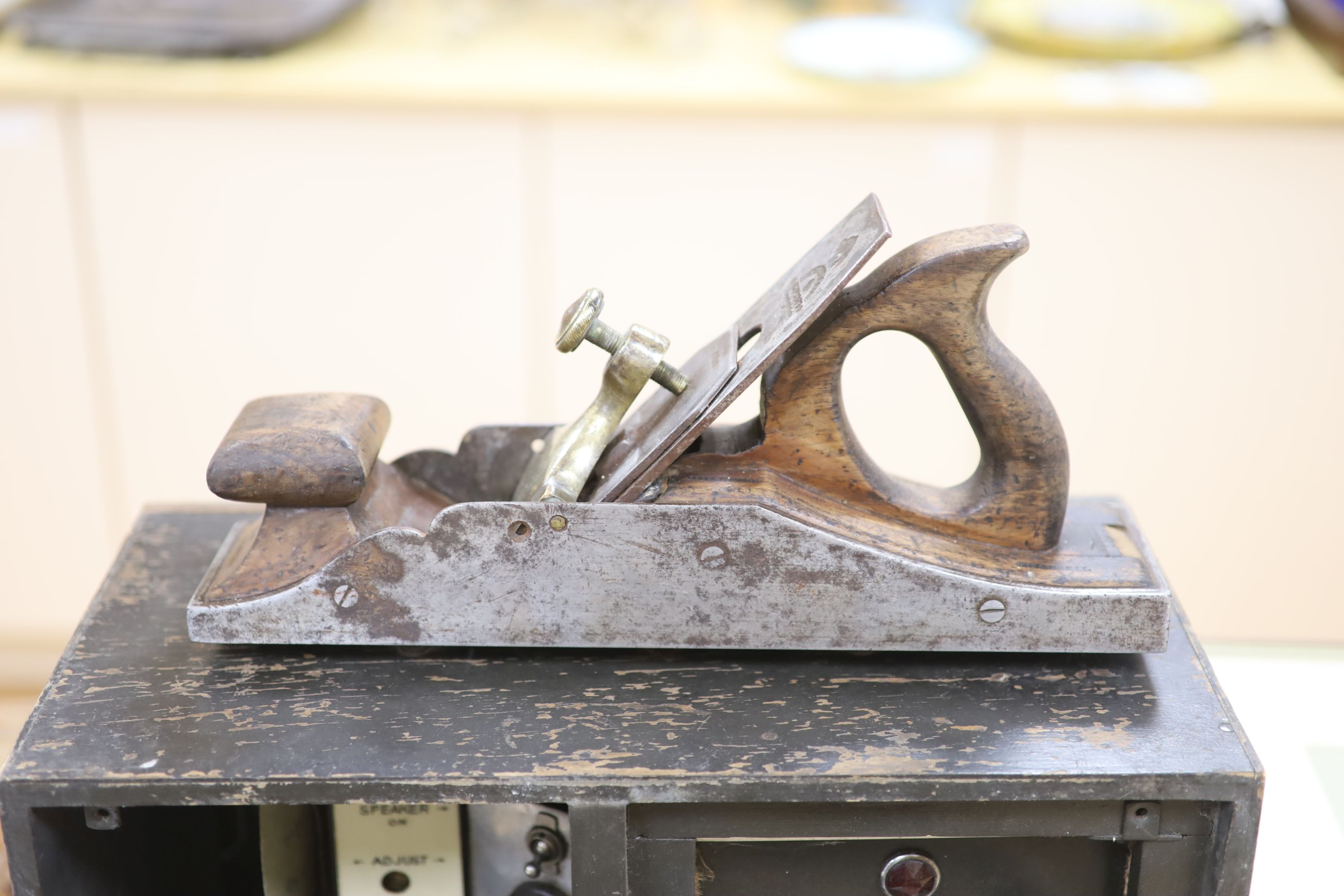 A collection of vintage tools including woodworker's planes and saws